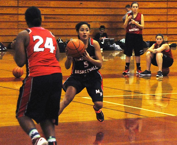 Skyleen Inthatirath of Marysville-Pilchuck goes through a play at practice.