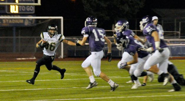 Marysville Getchell’s Wil Owens rushes past a host of Knights during the Friday