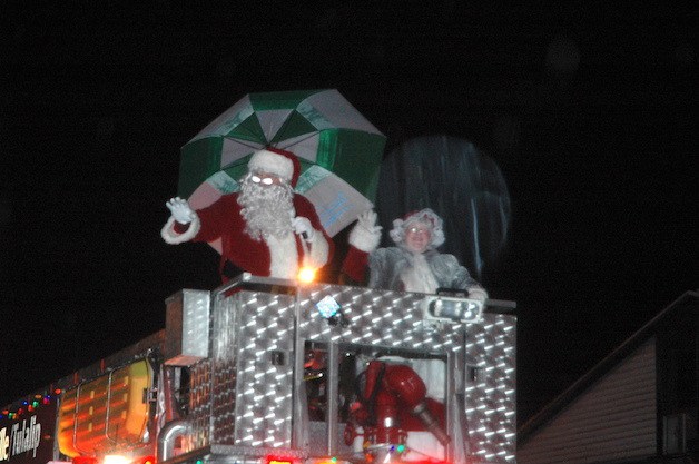 Santa braves the rain to greet the attendees of the Merrysville for the Holidays Electric Lights Parade Dec. 5.