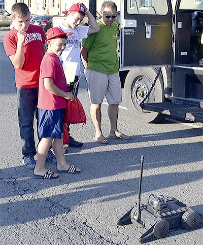 Onlookers marvel at the robot Marysville police's SWAT team uses during the National Night Out Fight Against Crime event at Comeford Park Aug. 4.