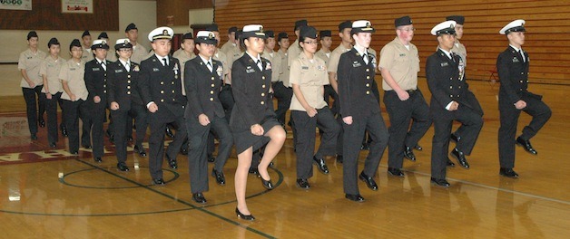 The Marysville Tomahawk Company Naval Junior ROTC Unarmed Drill Team struts its stuff during their annual evening parade on Nov. 14.