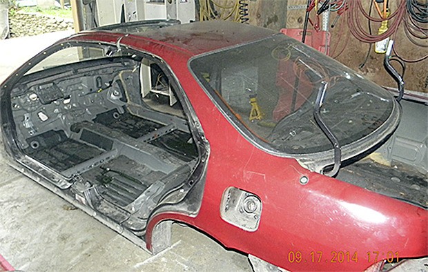 This vehicle that has been stripped of its parts was found at the alleged 'chop shop.'