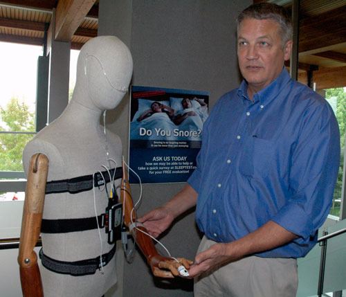 Arlington dental surgeon Dr. Alan Erickson shows off an alternative to the standard sleep apnea monitor at Cascade Valley Hospital on Sept. 14.