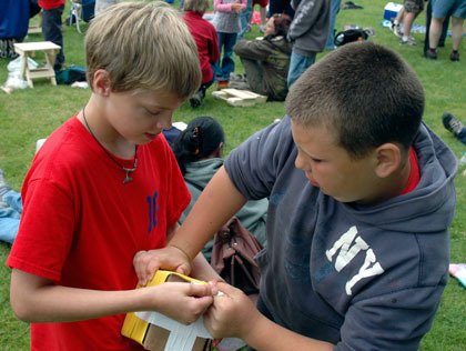 Ten-year-olds Hunter Corbett of Marysville and Garrett Gullidge of Tulalip open up Corbett's egg contain on Thursday