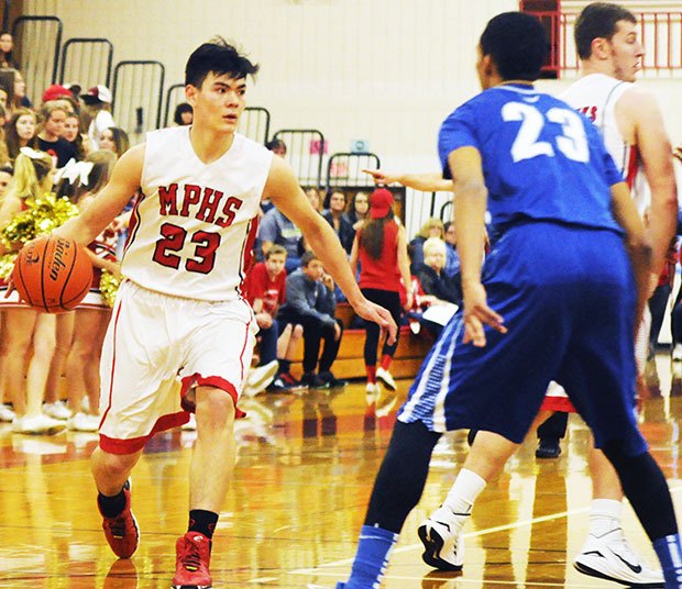 Marysville-Pilchuck's Michael Painter dribbles the ball against Shorewood.