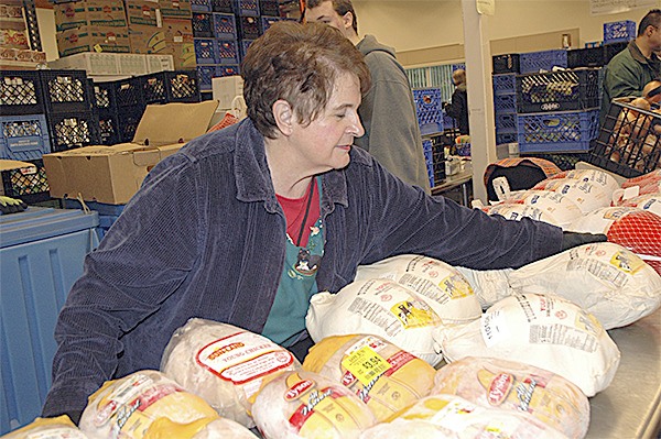 Diane Mason sorts chickens