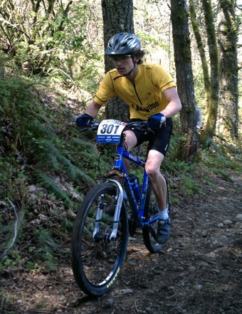Tyler Carr keeps control as he rattles down the rough dirt paths of the Washington State High School Mountain Bike Championships at Joint Base Lewis-McChord.