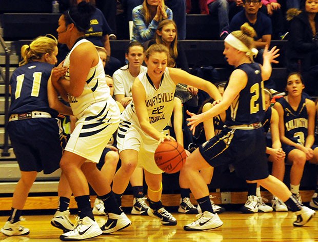 Marysville-Getchell's Gabby Grandbois dribbles against Arlington defenders.