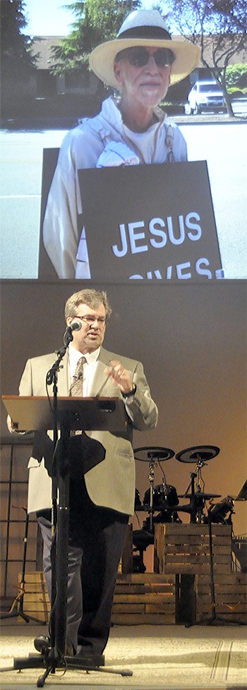 Pastor Craig Laughlin of the Marysville Church of the Nazarene talks about Gary Haga at his memorial service Jan. 16. Haga died last month after a battle with cancer. Haga walked four miles a day carrying a sandwich board sign promoting the love of Jesus.