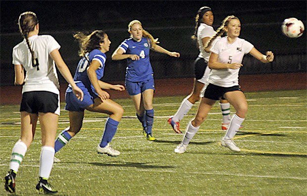 Players go after a free ball during Lakewood's soccer game recently.