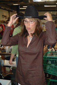 Marysville's Linda Dolstad tries on a cowboy hat at the Marysville Goodwill's annual 'Western Days' sale Aug. 13.
