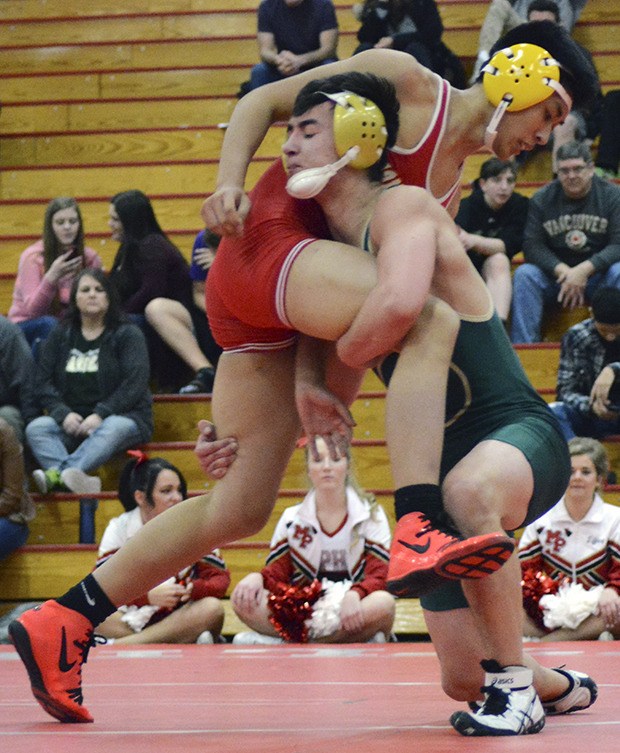 A Marysville Getchell wrestler shoots for a takedown.