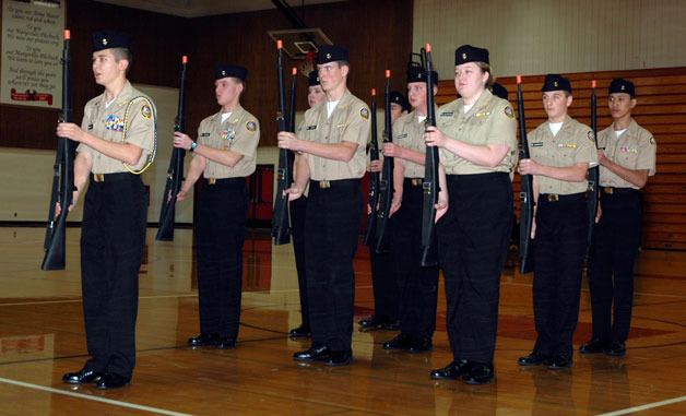 The Marysville Naval Junior ROTC drill team demonstrates rifle maneuvers at their evening parade ceremony at the   High School gymnasium Dec. 2.