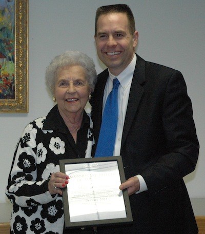 Mary Jane Miller receives her Volunteer of the Month award from Marysville Mayor Jon Nehring.