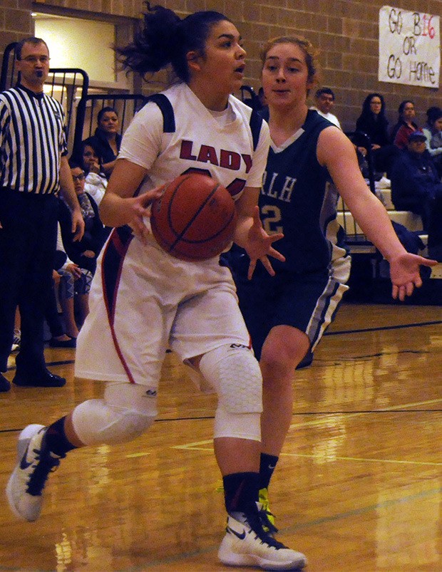 Tulalip's Keryn Parks drives toward the basket in the girls basketball game against Mount Rainier Christian Feb. 13.