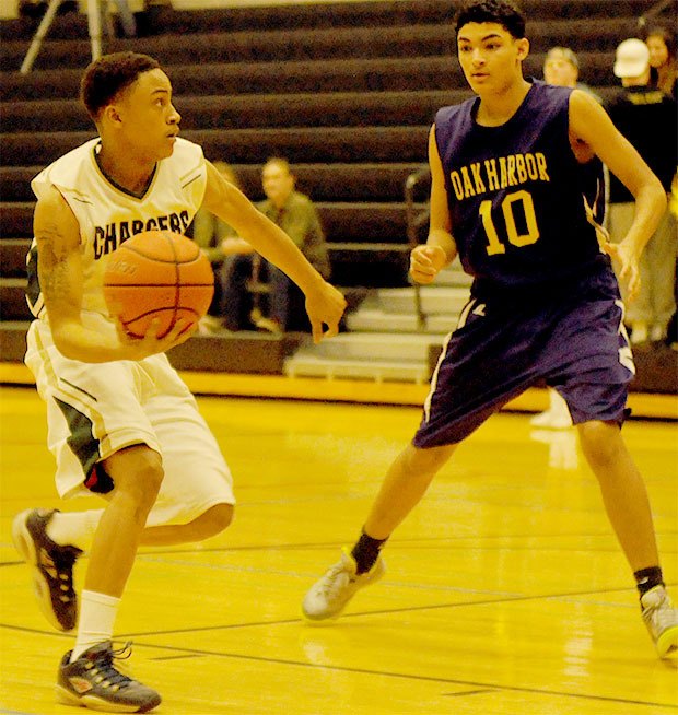 Marysville-Getchell's Derrick Phillips Jr. sets himself up for a layup in the Chargers' game against Oak Harbor Feb. 3.