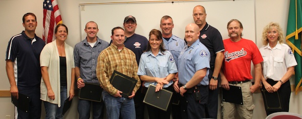 Eleven of the 20 Marysville Fire District members who were honored for their years of service on Sept. 21. Front row from left