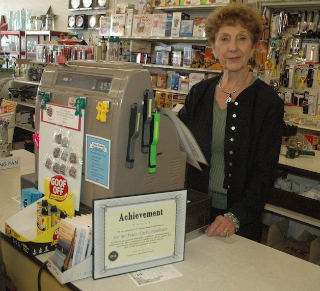Carr's Hardware owner Darlene Scott works the same cash register the store acquired in the 1960s.