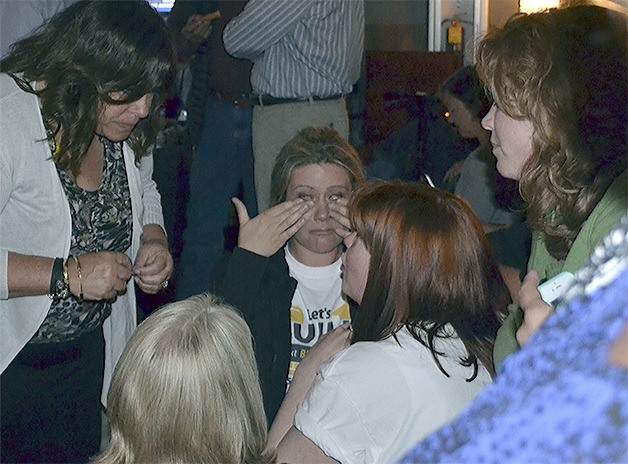 Christen Dickerson wipes tears from her eyes after finding out the Marysville school bonds received only 48 percent approval in Tuesday's election. She is surrounded by her co-director for Citizens for Marysville Schools