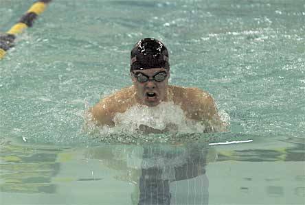 Brandon Caldwell on his way to winning the 100-yard breaststroke race.