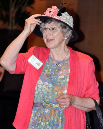 Donna Murrish tries on a fancy floral hat during the Marysville Historical Society’s Ninth Annual Spring Tea and Fashion Show at the Tulalip Resort and Casino on April 22.