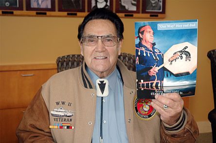 Stanley Jones Sr. shows off a copy of the book he’s written about the Tribes and his life.