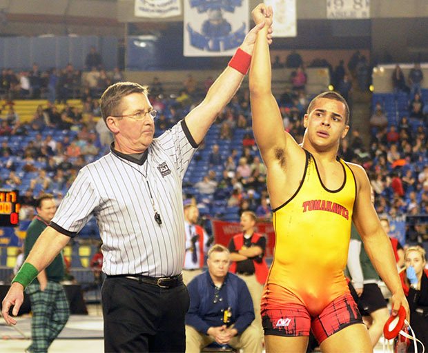 Marysville-Pilchuck's Killian Page gets his arm risen as state champion.