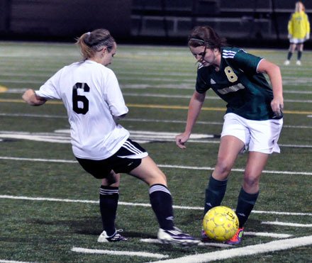 Getchell junior Brianna Moore-Green fights off a Lynnwood defender to maintain possession.