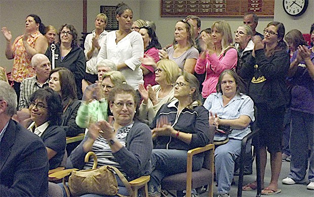 Union members applaud contracts approved by the Marysville School Board.