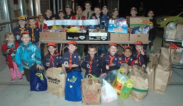 Members of Cub Scout Pack 180 present 668 pounds of food items to Marysville Community Food Bank on Nov. 21.