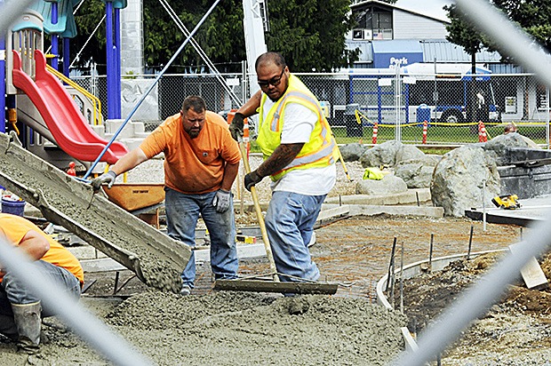 Workers pour cement Tuesday