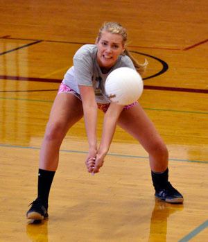 Lakewood High School varsity volleyball player Rachel Reinecke digs a ball during a training drill on Aug. 30.