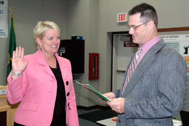 Dr. Becky Berg is sworn in as superintendent of the Marysville School District by Marysville School Board President Chris Nation on July 8