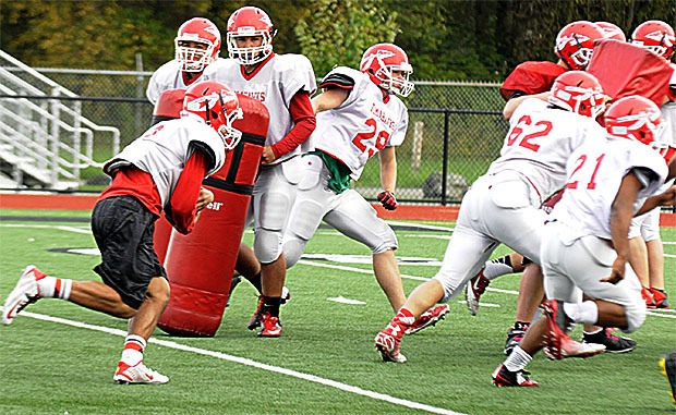 Marysville-Pilchuck's football team practices for its upcoming game against Meadowdale.
