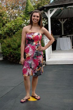 Model Maria DeMatteo shows off a strapless print dress during the Marysville Strawberry Festival fashion show on Wednesday