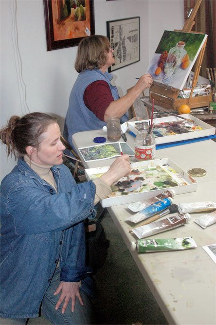 Monica Yantis and her daughter Kristina Hebert paint together in Yantis’s studio in preparation for the upcoming Art in the Barn at the Yantis farm in Oso.