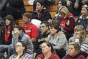 Parents listen and wear their emotions on their faces at the meeting with the school district Tuesday.
