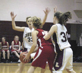 Lakewood seniors Anna Work (#33) and Jocelyn Shafer (#30) double team a Bellingham player.