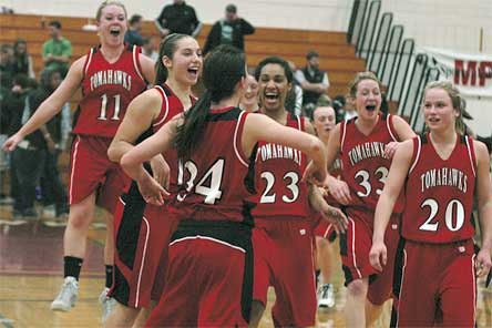 Marysville-Pilchuck girls hoops players celebrate after beating Edmonds-Woodway in the District 1 tournament semifinals and earning the school’s first state berth in 13 years.
