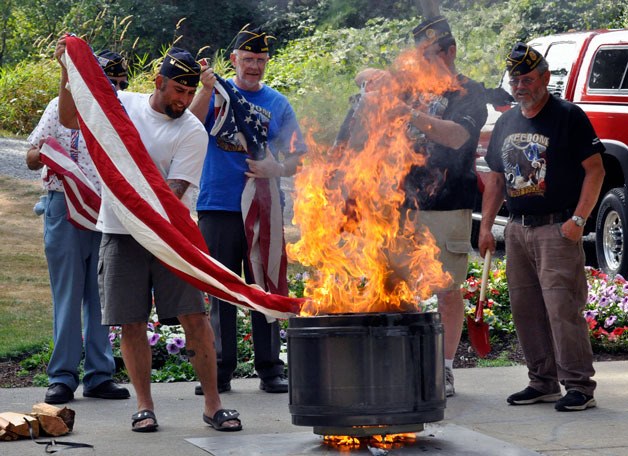Members of American Legion Post 178 perform a flag retirement ceremony at Jennings Park Pavilion in Marysville on Sept. 8.