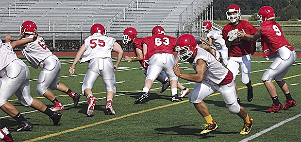 Marysville offense practices hand-off and blocking scheme at its first practice.