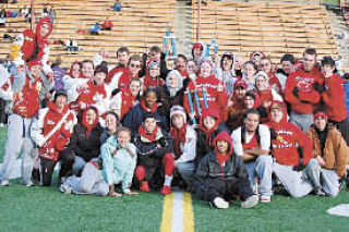 The Tomahawk track team poses on the field after the girls won the Kent-Meridian Invite early in the spring 2008 season. The win came early in a season with many more impressive wins including a conference championship and the first girls district title in 32 years.