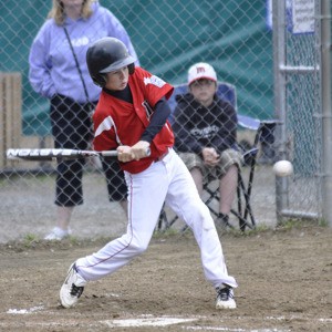 Marysville's Alex Belmont looks to connect with a pitch during the District 1 All-Star tournament at Quake Field