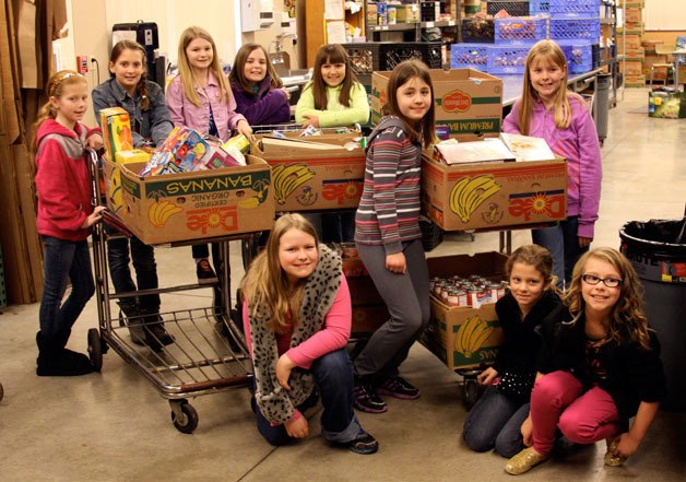 The attendees of Fallyn Gentry’s 10th birthday party at the Marysville Community Food Bank on March 16 brought 459 pounds of food. Back row from left