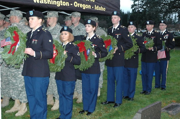 Members of the 334th Chemical Biological Radiological and Nuclear Operations Company line up to present wreaths honoring the branches of the military during the Dec. 12 'Wreaths Across America' event at the Marysville Cemetery.