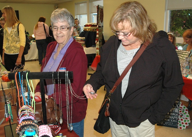 Janet Sperry and Vicki Robinson check out the selection at the autumn craft fair.