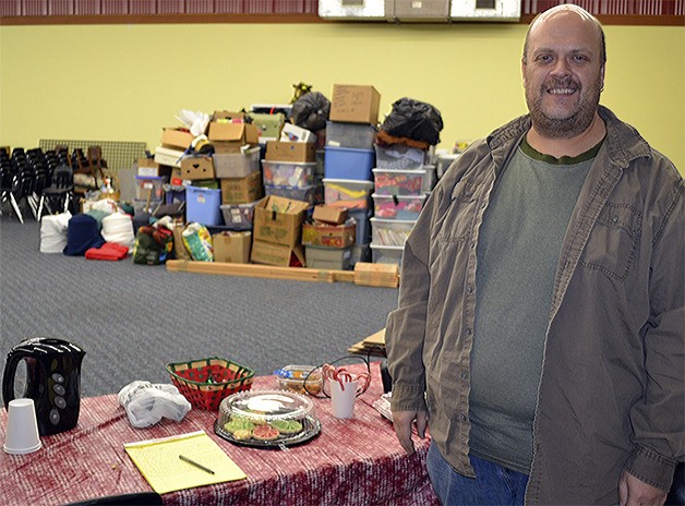 Scott Randall of Red Curtain is shown with dozens of boxes full of props and other items that were set to be moved to their new site