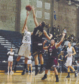 Arlington guard Quinn Kesselring shoots late in the girls’ 37-25 win over Cascade. The junior had six of her eight points in the fourth quarter.