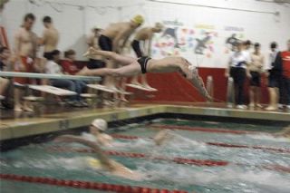 Sophomore Brandon Caldwell dives into the pool