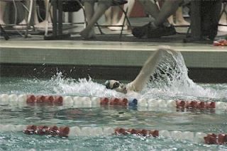 M-Ps Mario Reichlin swims the backstroke against Cascade. The freshman took fourth in 1:10.42.